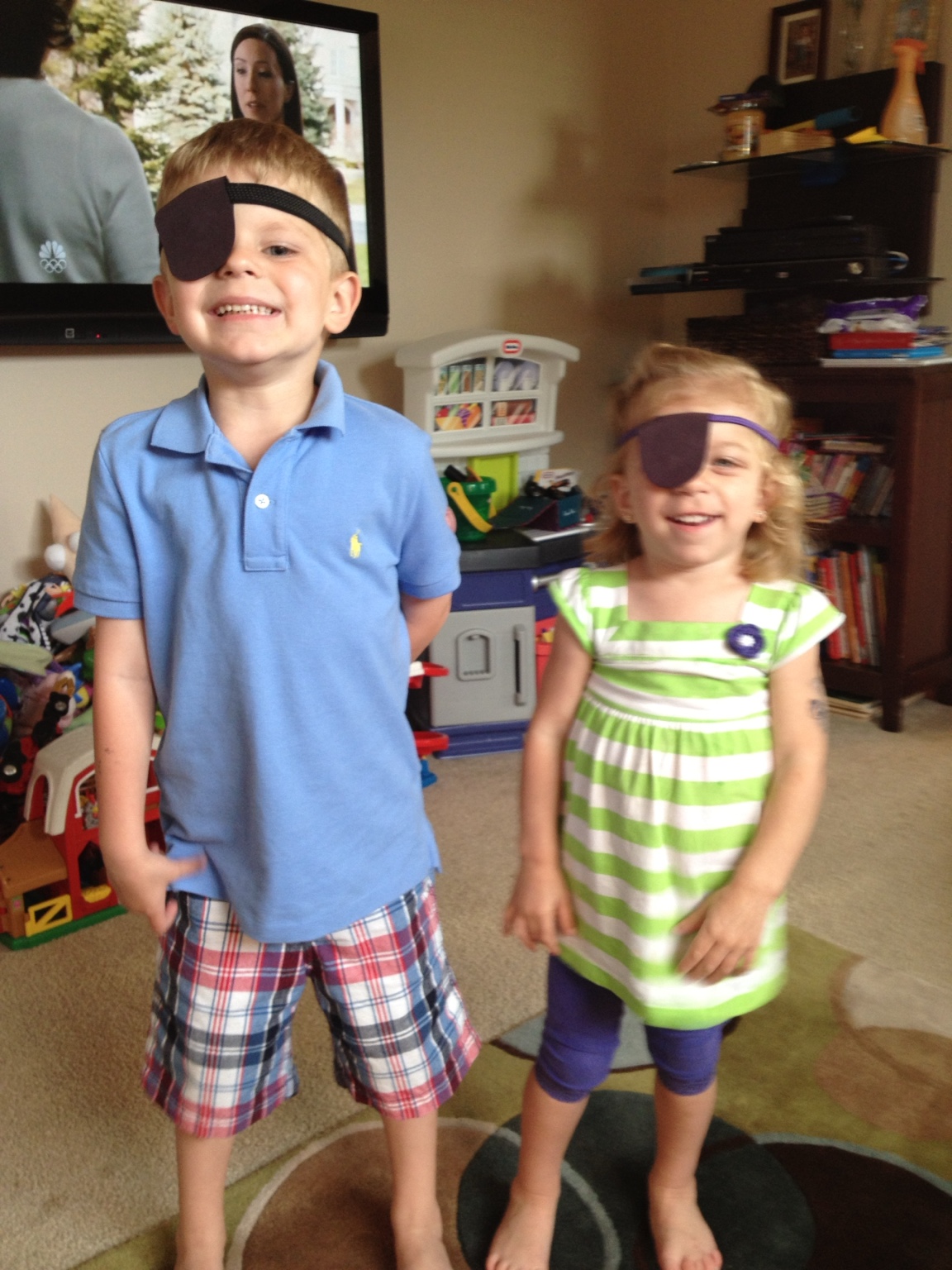 Lauren and Brady playing dress-up as children
