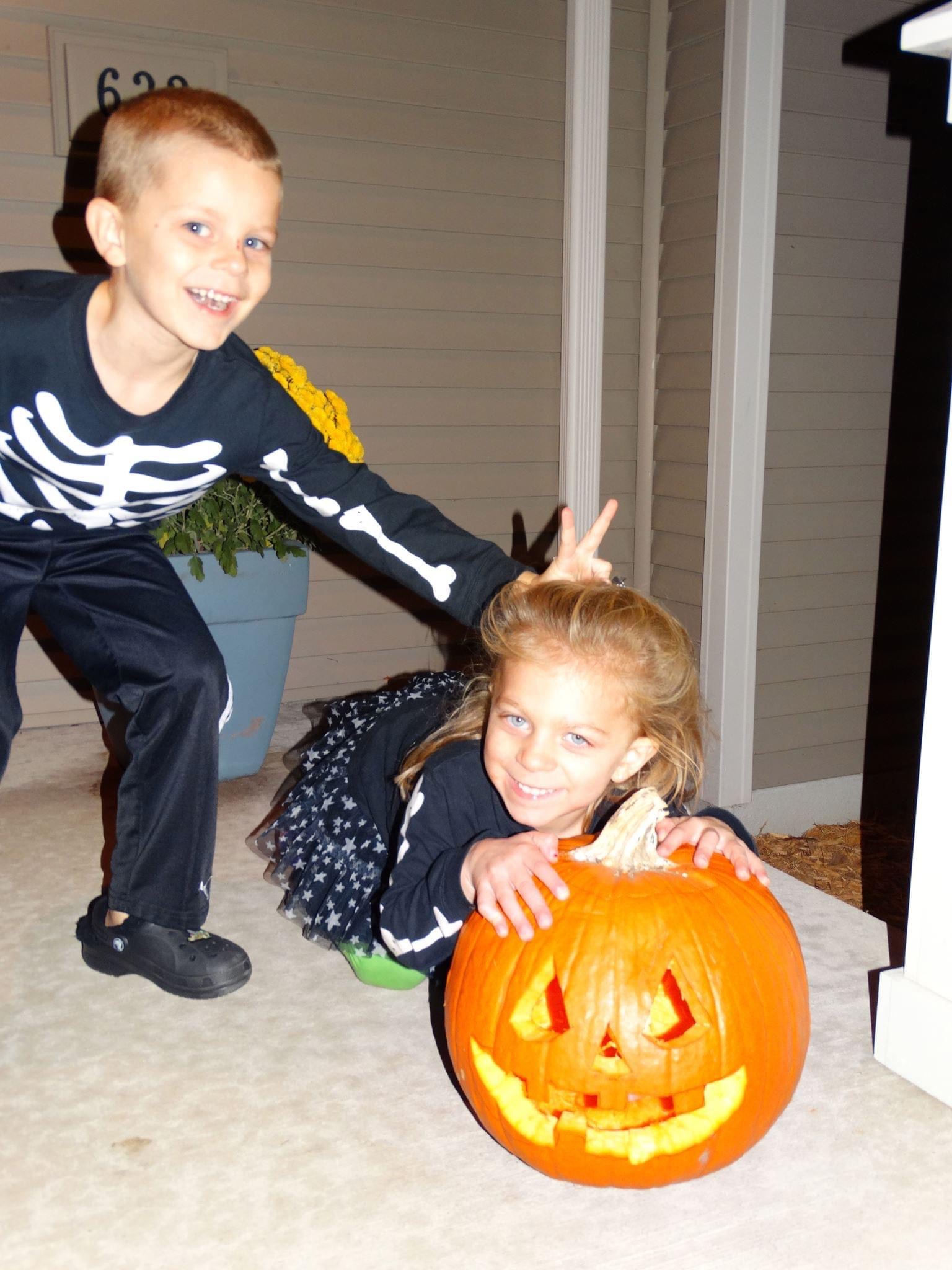 Lauren and Brady with a Halloween pumpkin